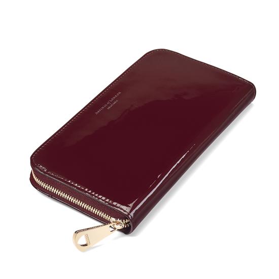 Continental Clutch Zip Wallet in Deep Shine Cherry Patent from Aspinal of London