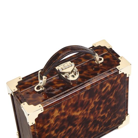 Mini Trunk Clutch in Deep Shine Tortoiseshell Patent from Aspinal of London